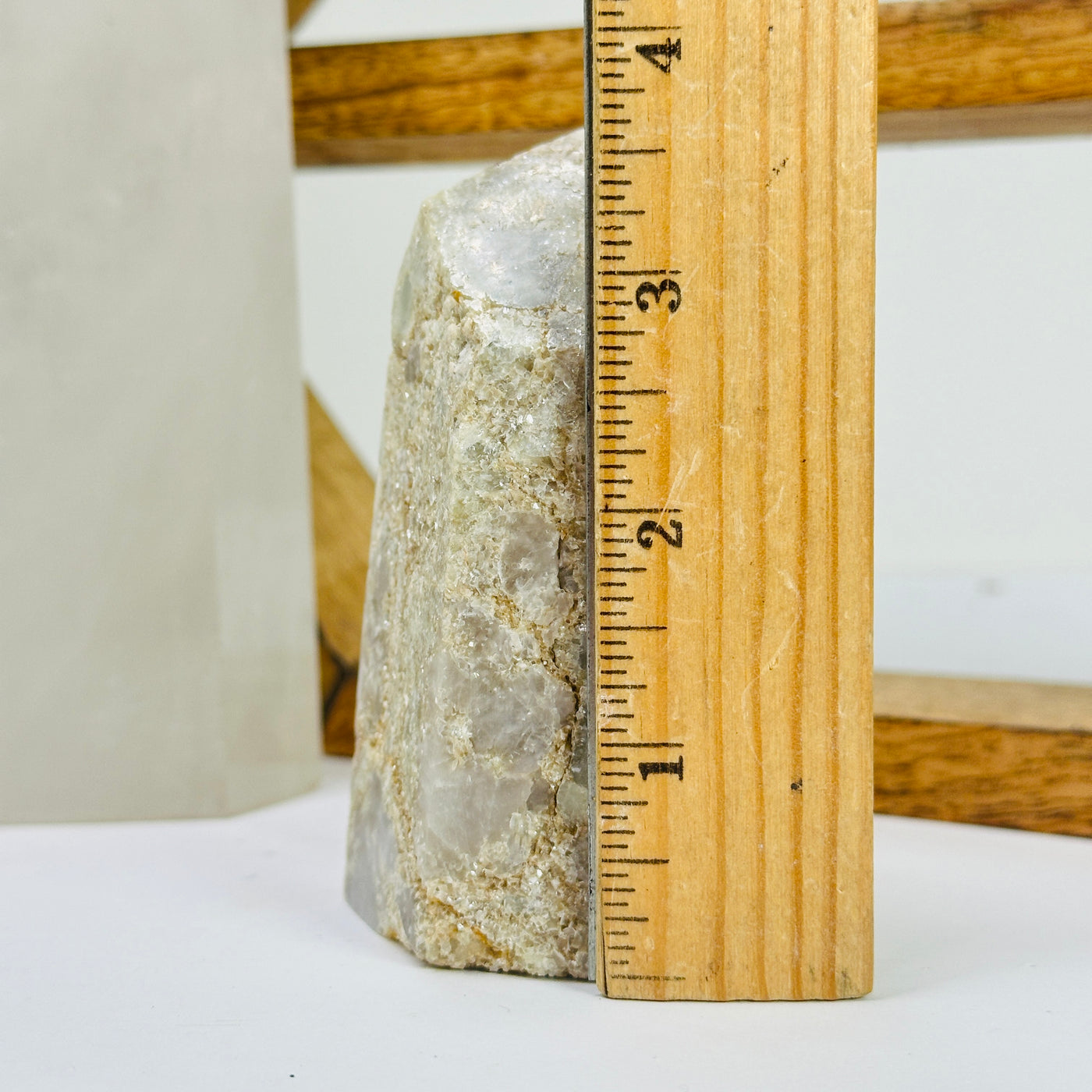 tourmaline point next to a ruler for size reference