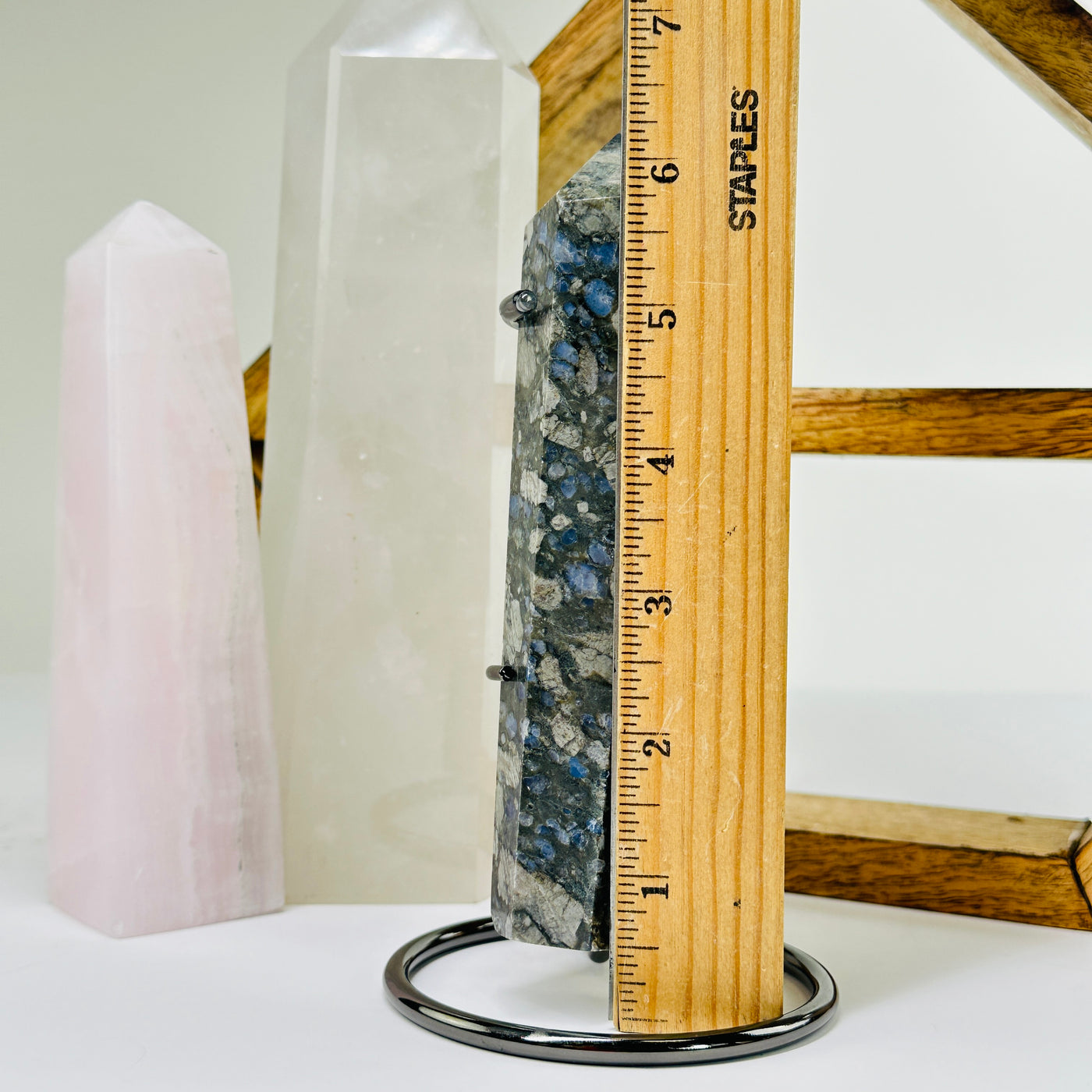 rhyolite point next to a ruler for size reference