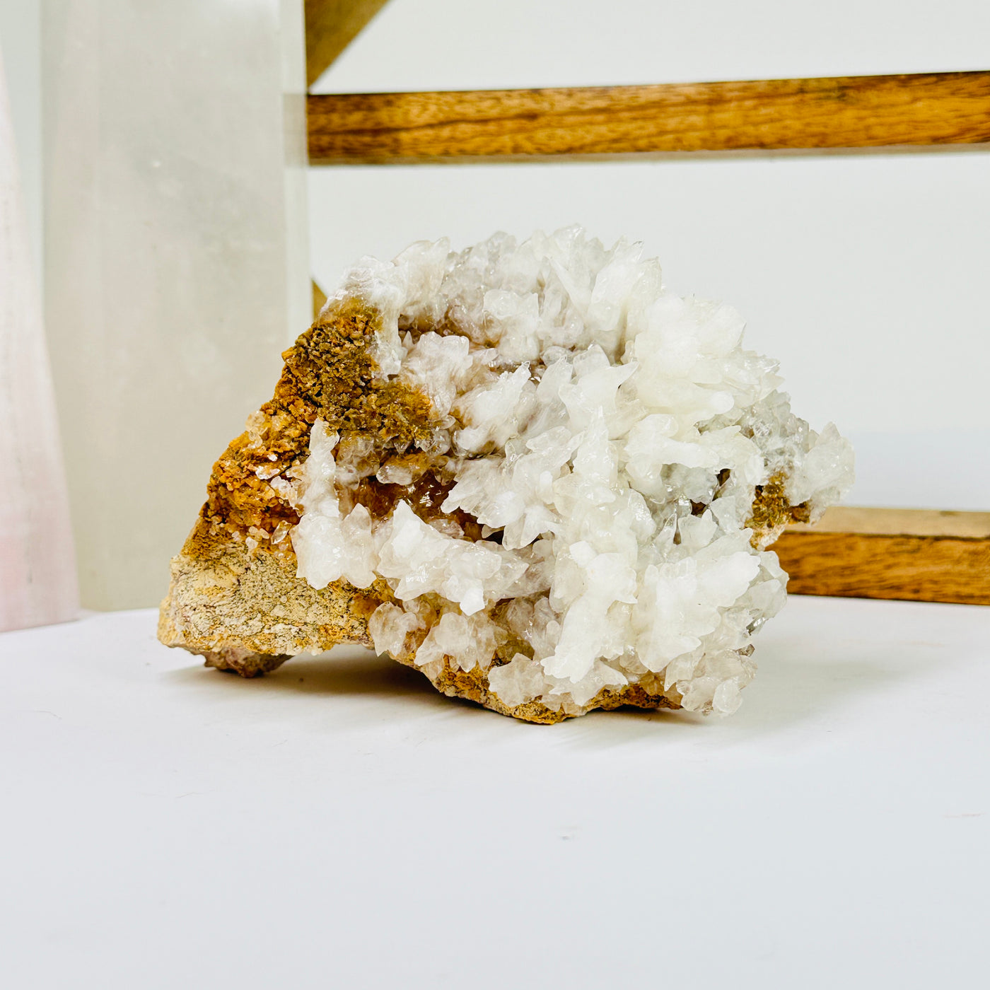 calcite on matrix with decorations in the background