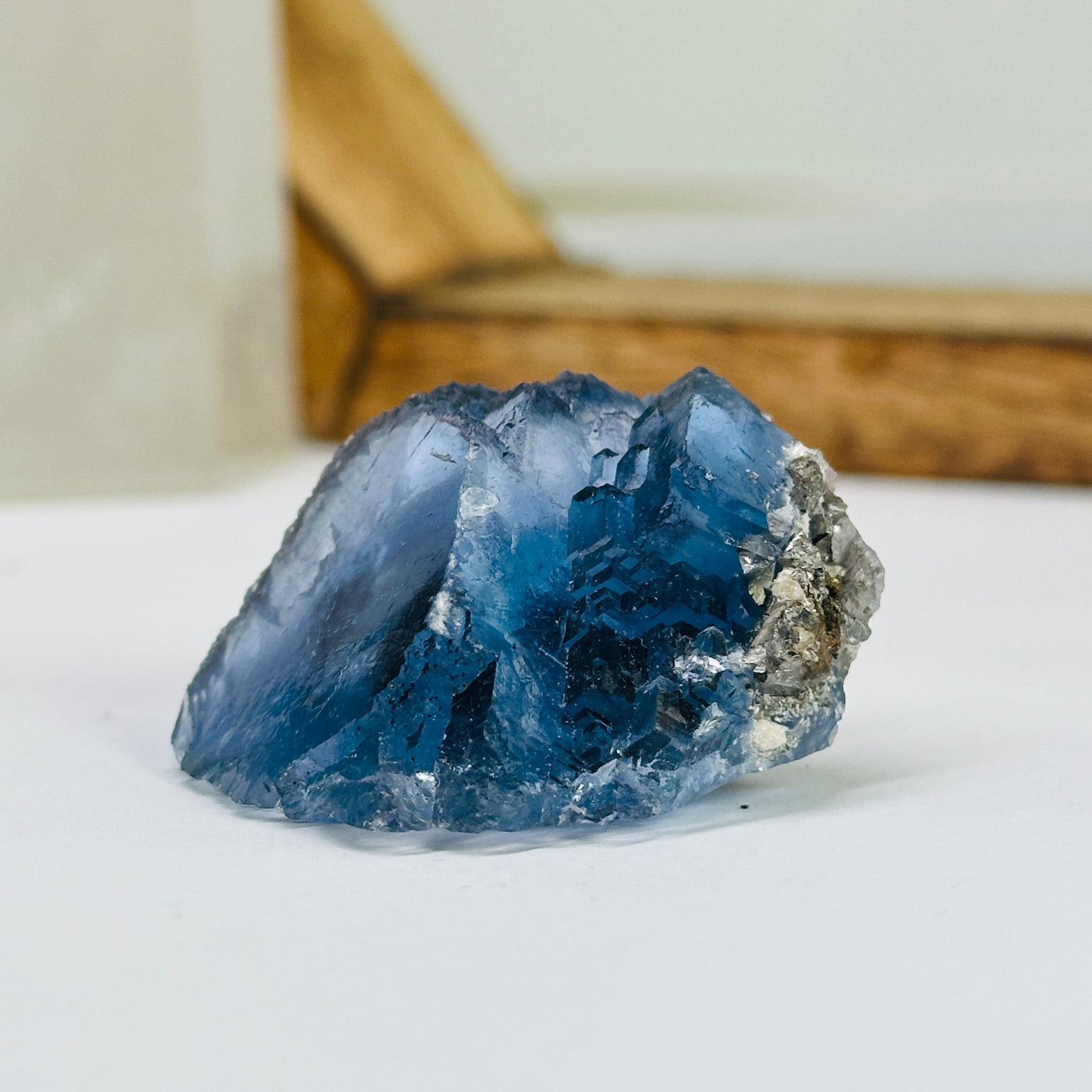 blue fluorite with decorations in the background