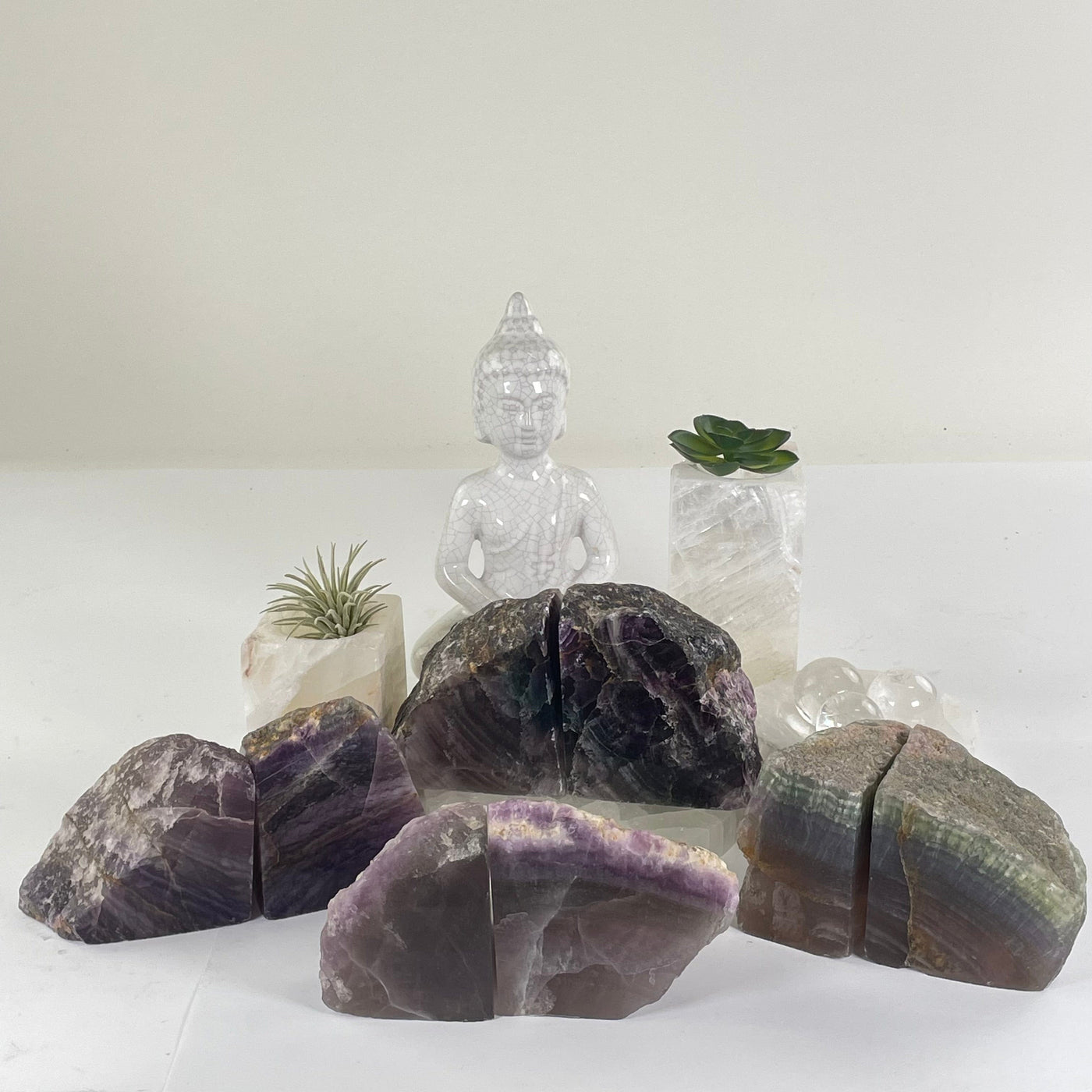 Fluorite Semi Polished Crystal Bookends - As Is - You Choose #3 all variants with props and plants in the background