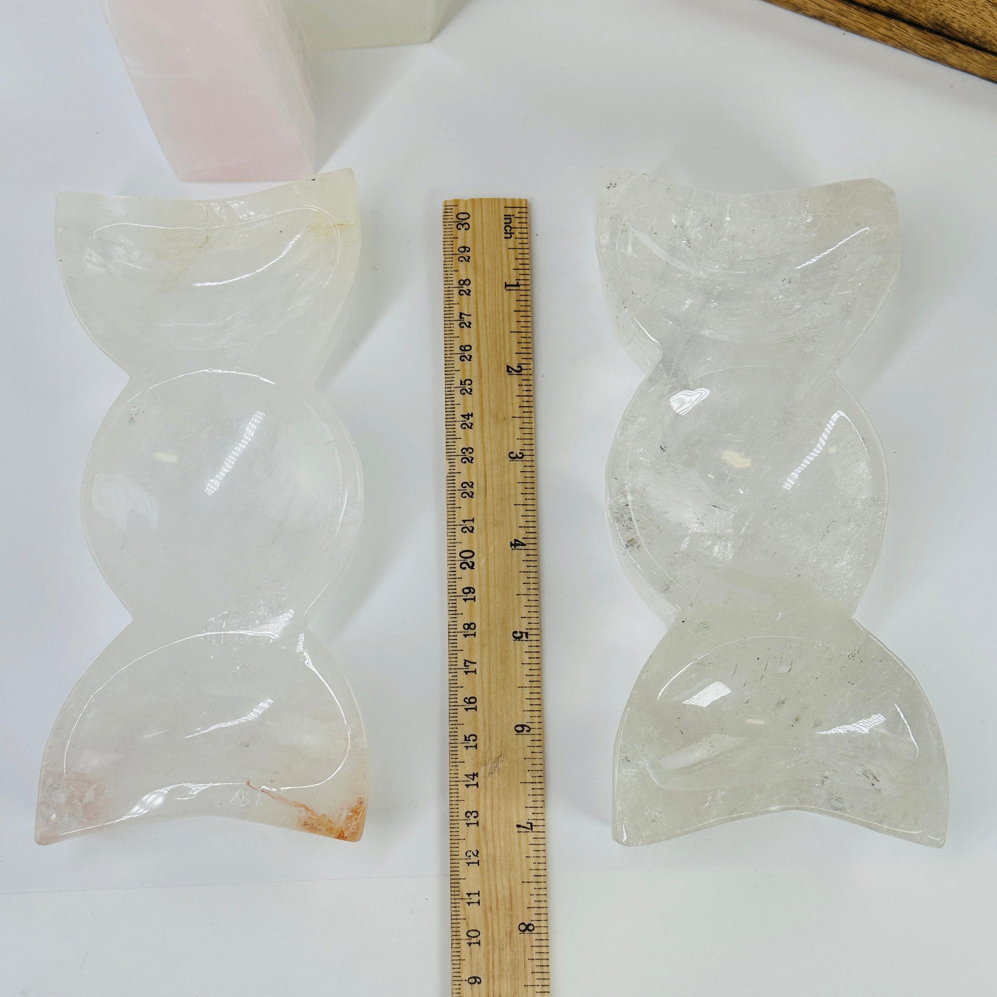 crystal quartz triple moon phase bowl next to a ruler for size reference