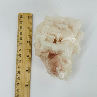 HALITE CLUSTER next to a ruler for size reference