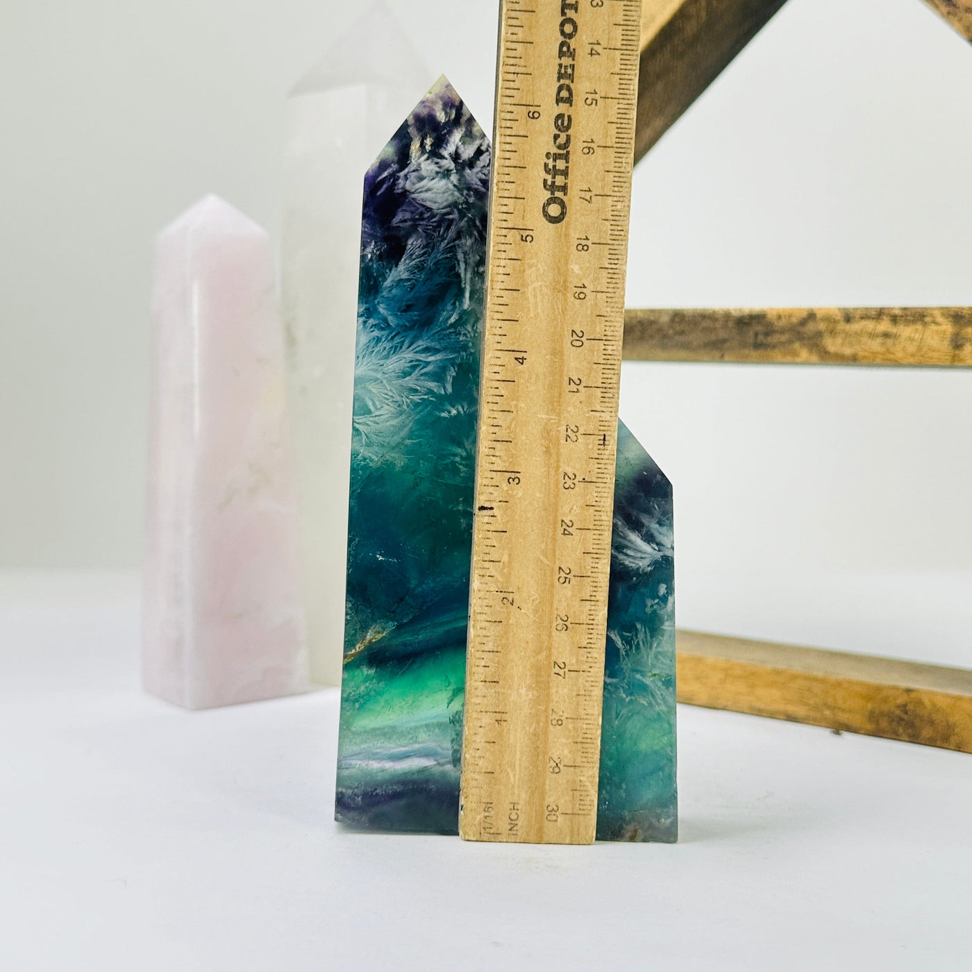 fluorite points next to a ruler for size reference