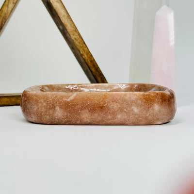 pink amethyst plate with decorations in the background