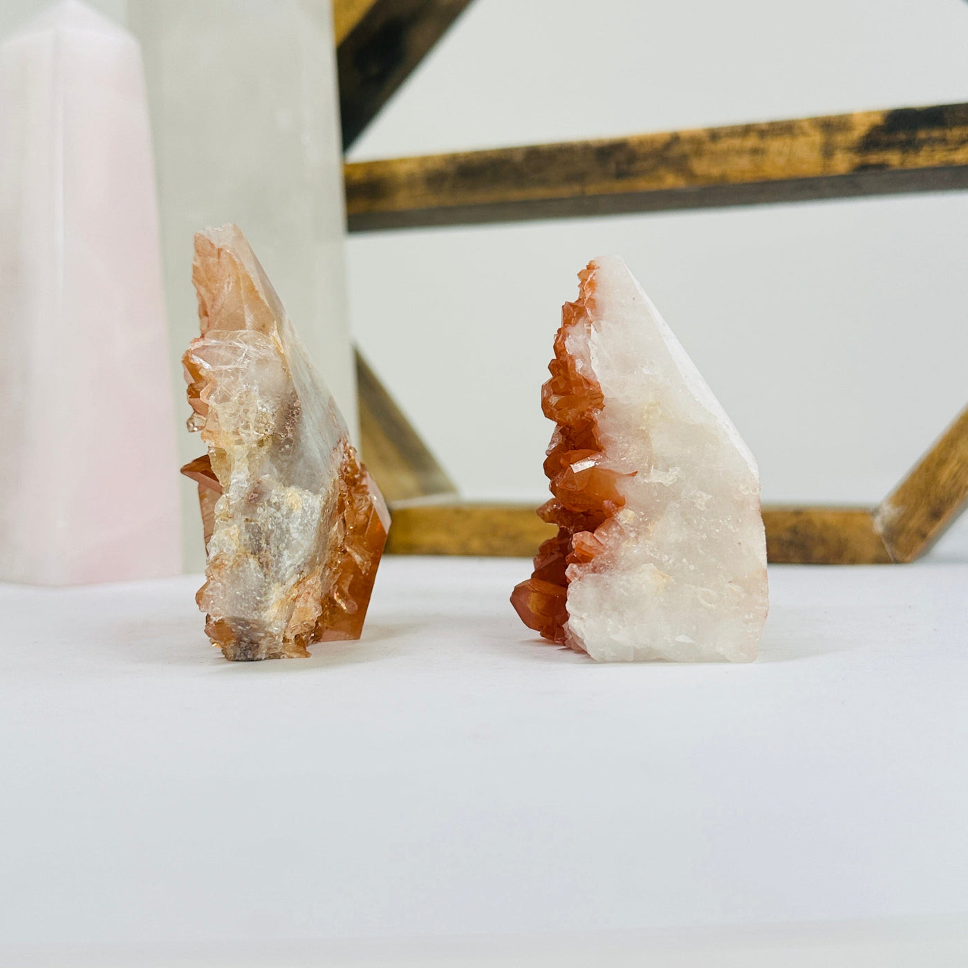 tangerine quartz points with decorations in the background