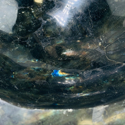 labradorite bowl with decorations in the background