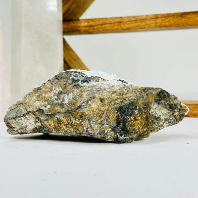 blue aragonite with decorations in the background