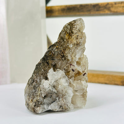 smokey quartz with decorations in the background