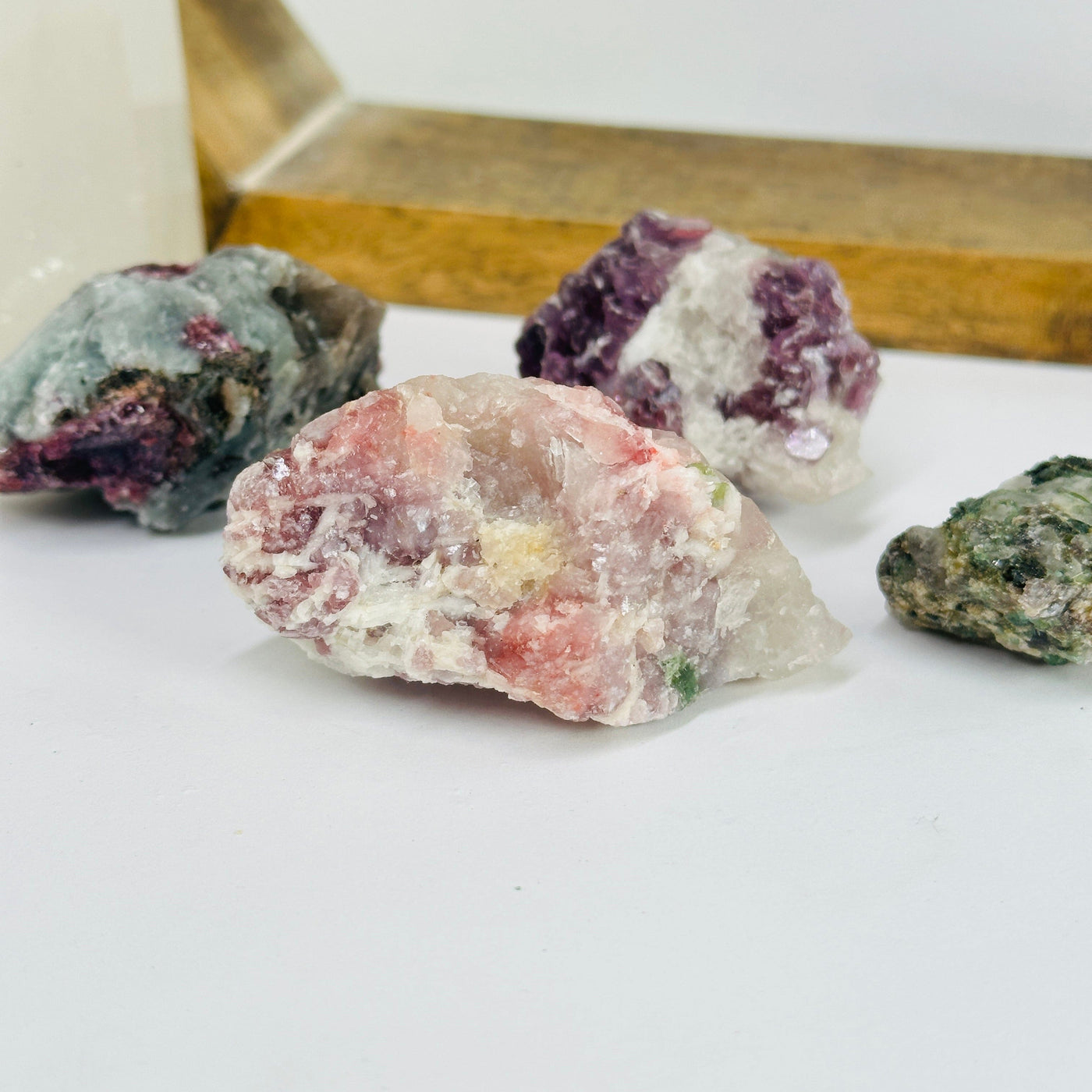 watermelon tourmaline with decorations in the background