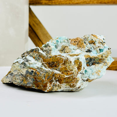 blue aragonite with decorations in the background