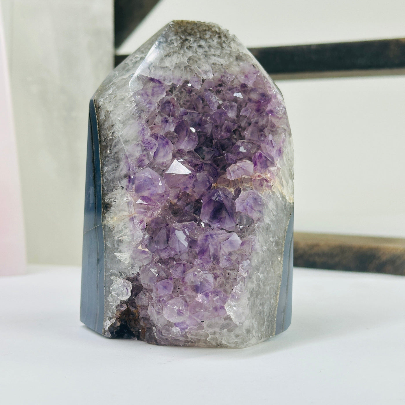 amethyst agate point with decorations in the background