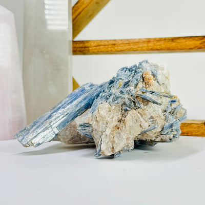 kyanite with decorations in the background