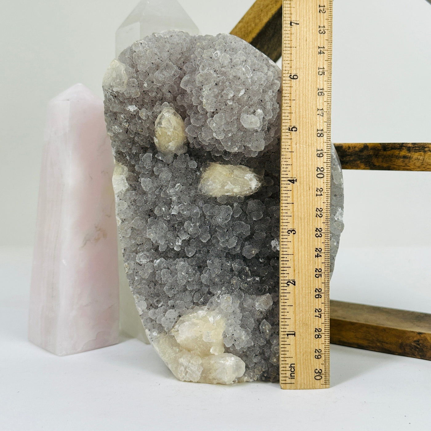 amethyst cut base next to a ruler for sizer reference