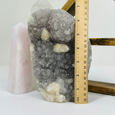 amethyst cut base next to a ruler for sizer reference