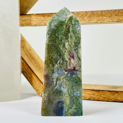 moss agate with decorations in the background