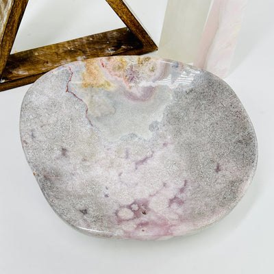 pink amethyst bowl with decorations in the background