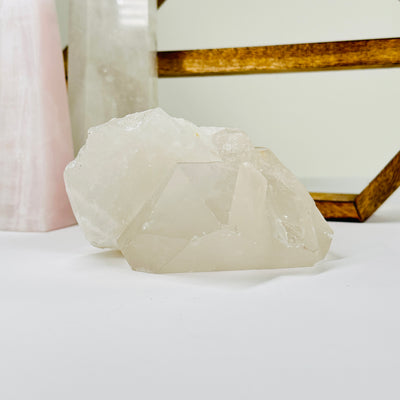 crystal quartz with decorations in  the background