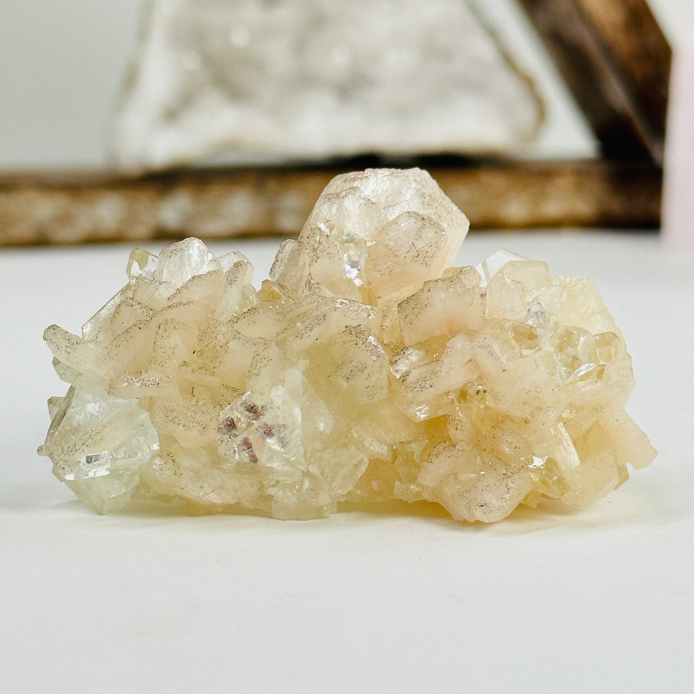 apophyllite with stilbite with decorations in the background
