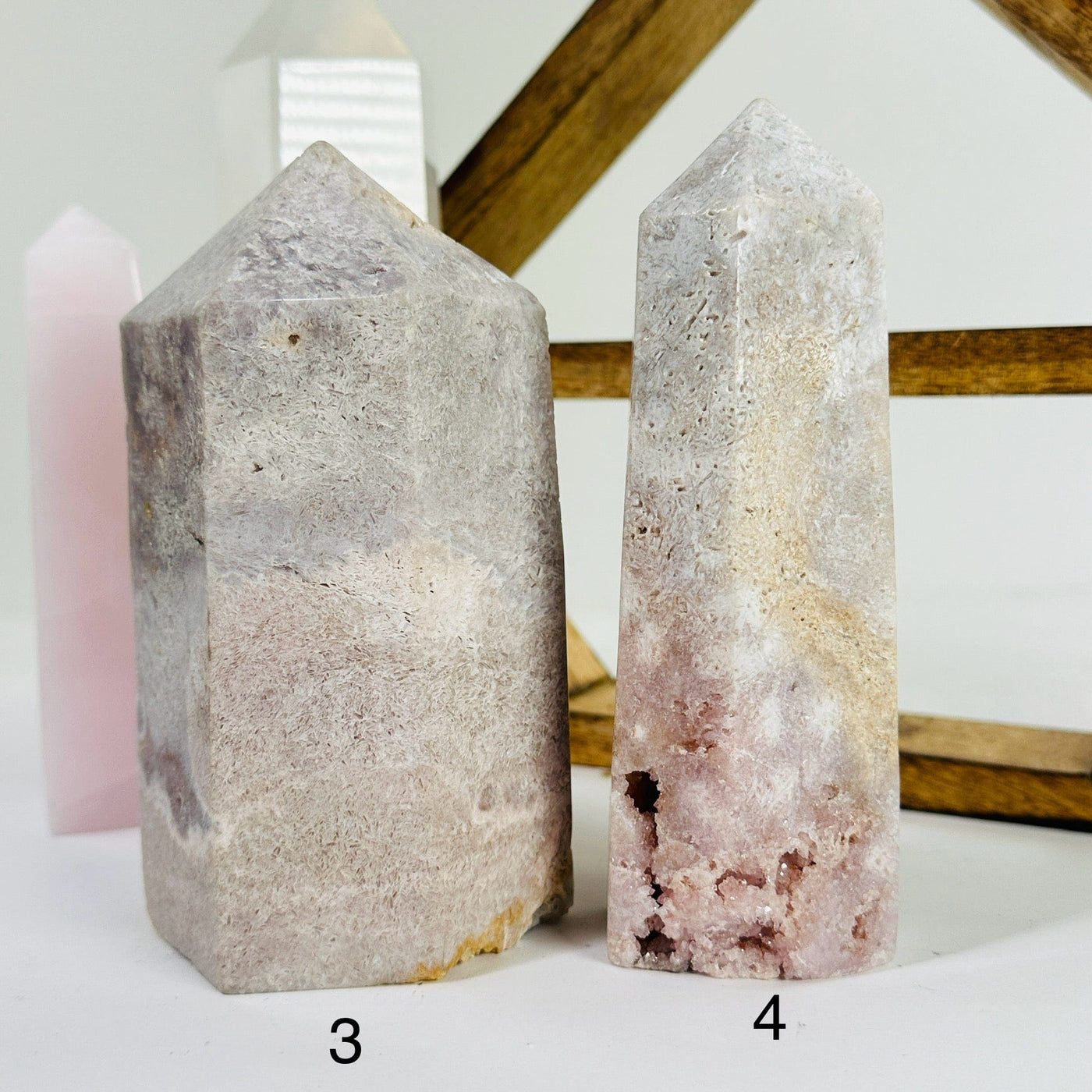 pink amethyst points with decorations in the background