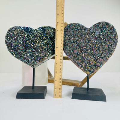 titanium coated heart on stand with decorations in the background