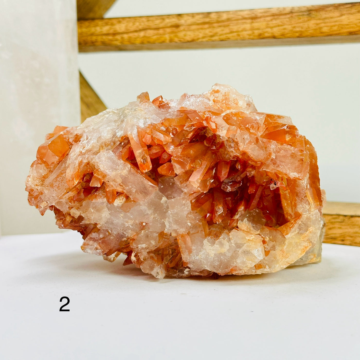 tangerine quartz with decorations in the background