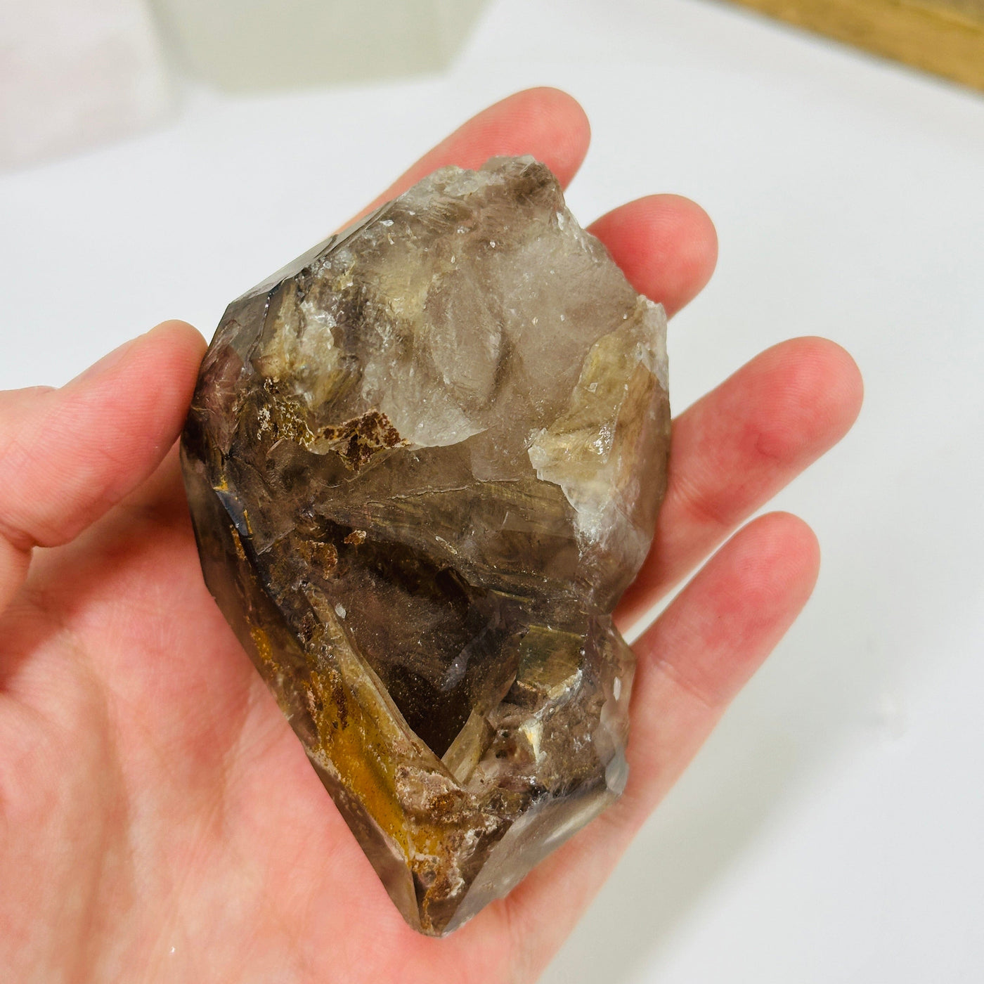 smokey quartz with decorations in the background