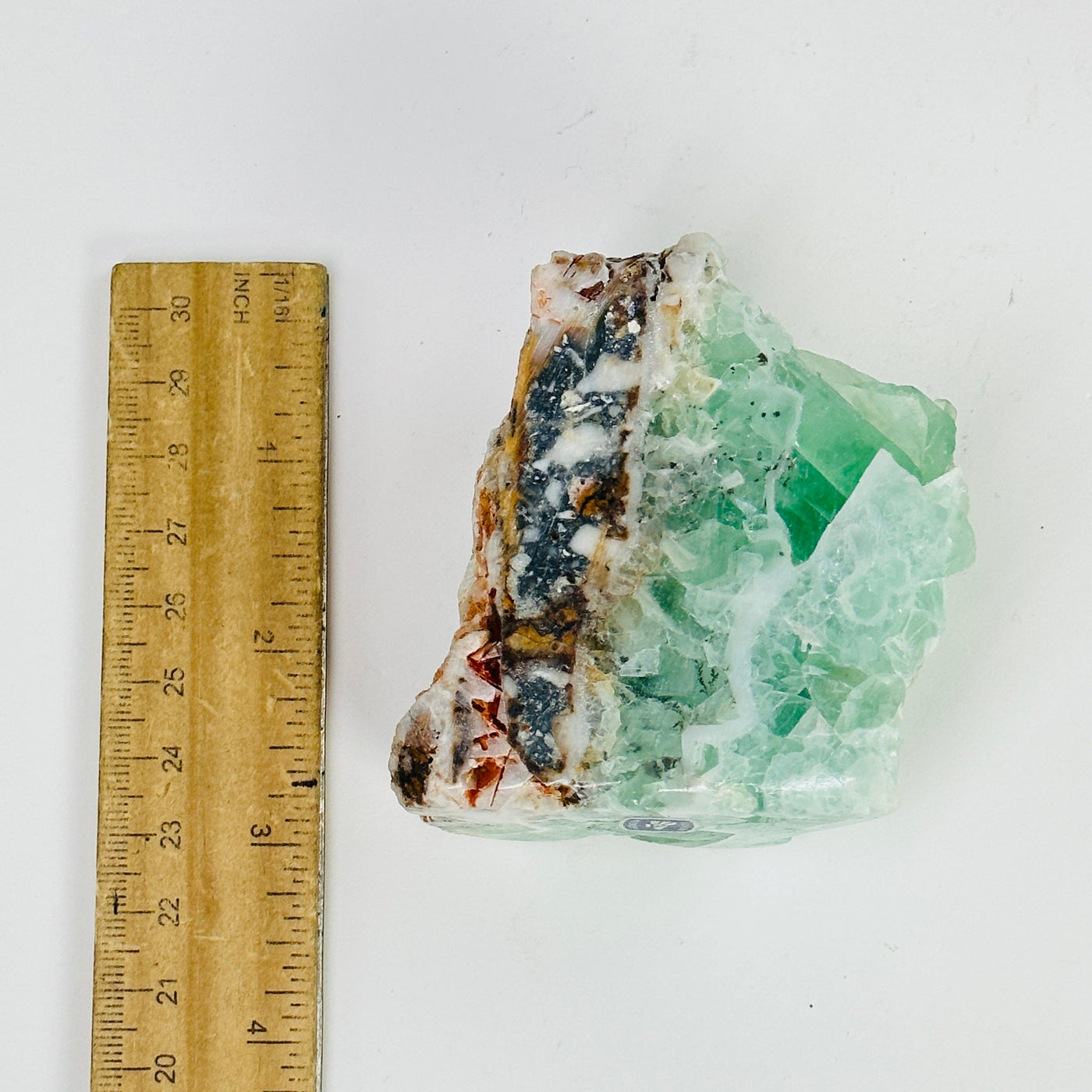 fluorite cut base next to a ruler for size reference