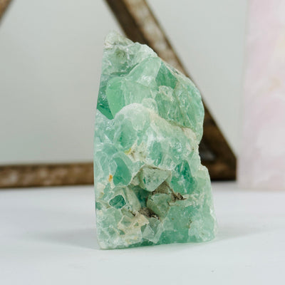 fluorite cut base with decorations in the background