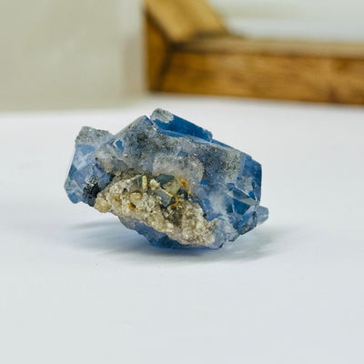 blue fluorite with decorations in the background