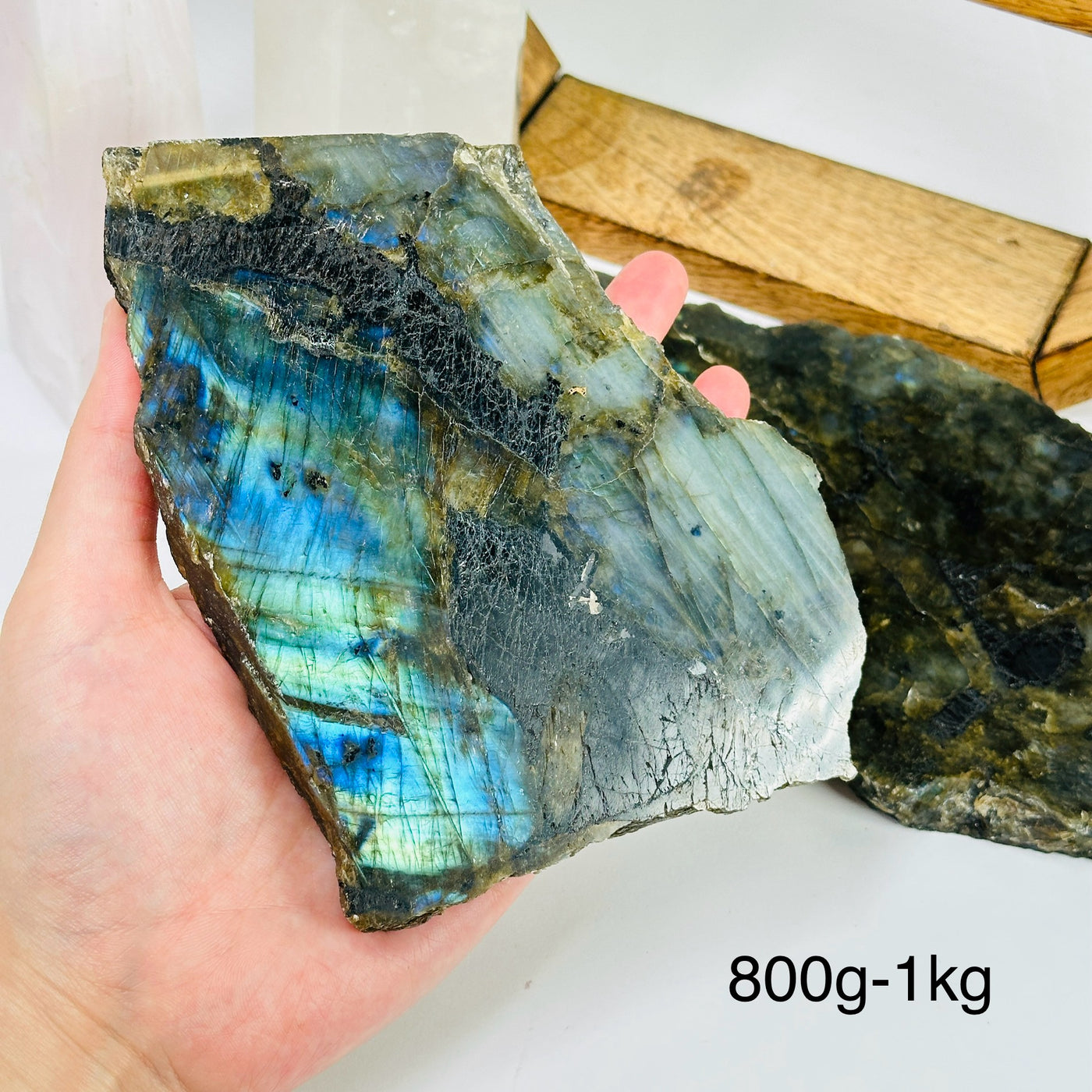 labradorite slab with decorations in the background