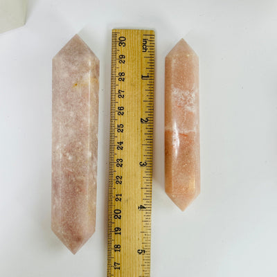 pink amethyst points with decorations in the background