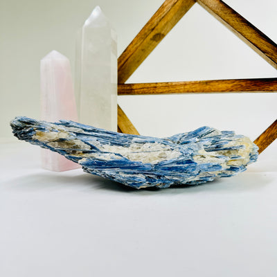 kyanite with decorations in the background