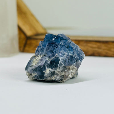 blue fluorite with decorations in the background