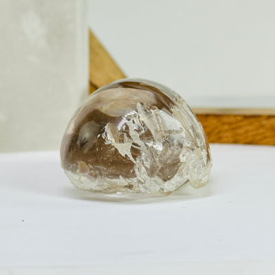 smokey quartz with decorations in the background