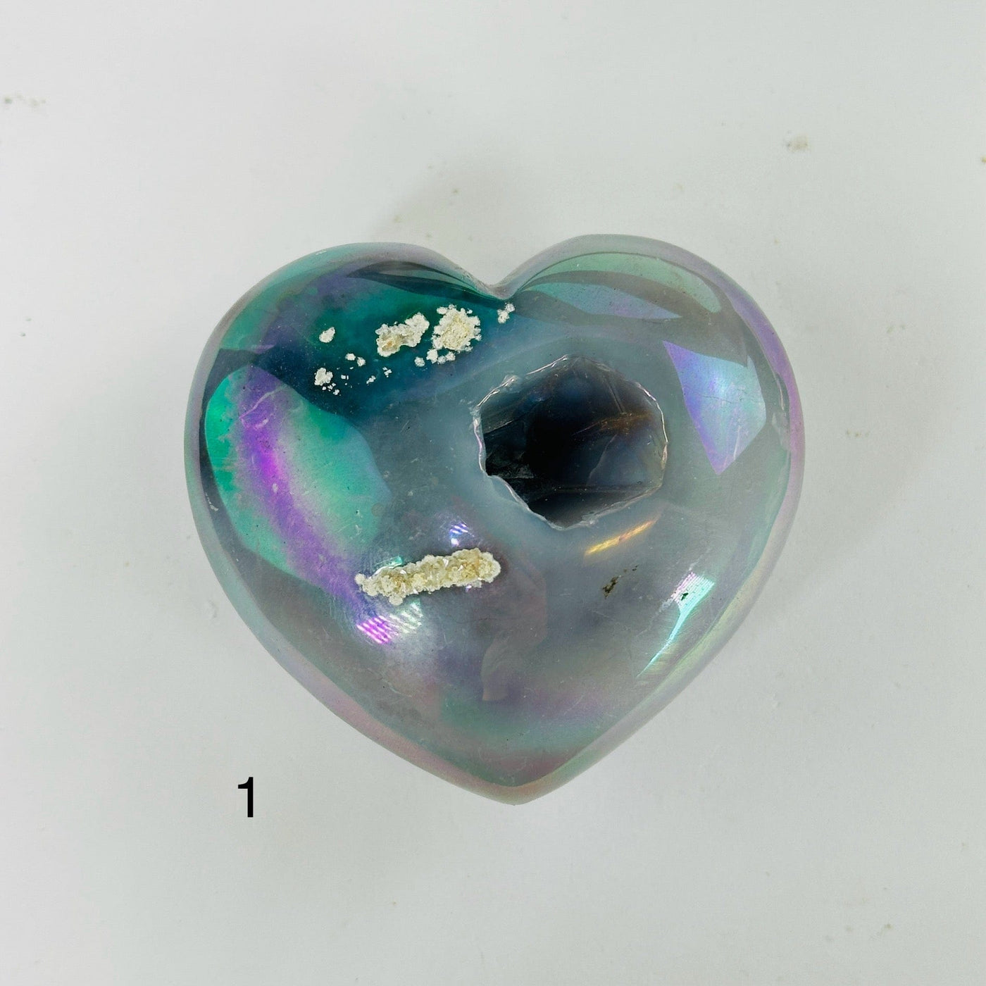 aura agate hearts with decorations in the background
