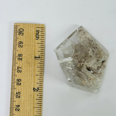 lodalite next to a ruler for size reference