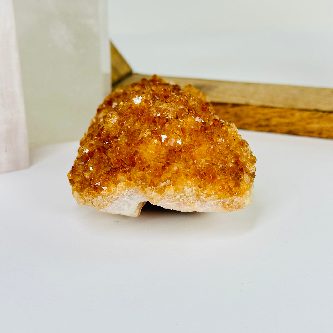 citrine cluster with decorations in the background