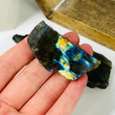 labradorite slab with decorations in the background