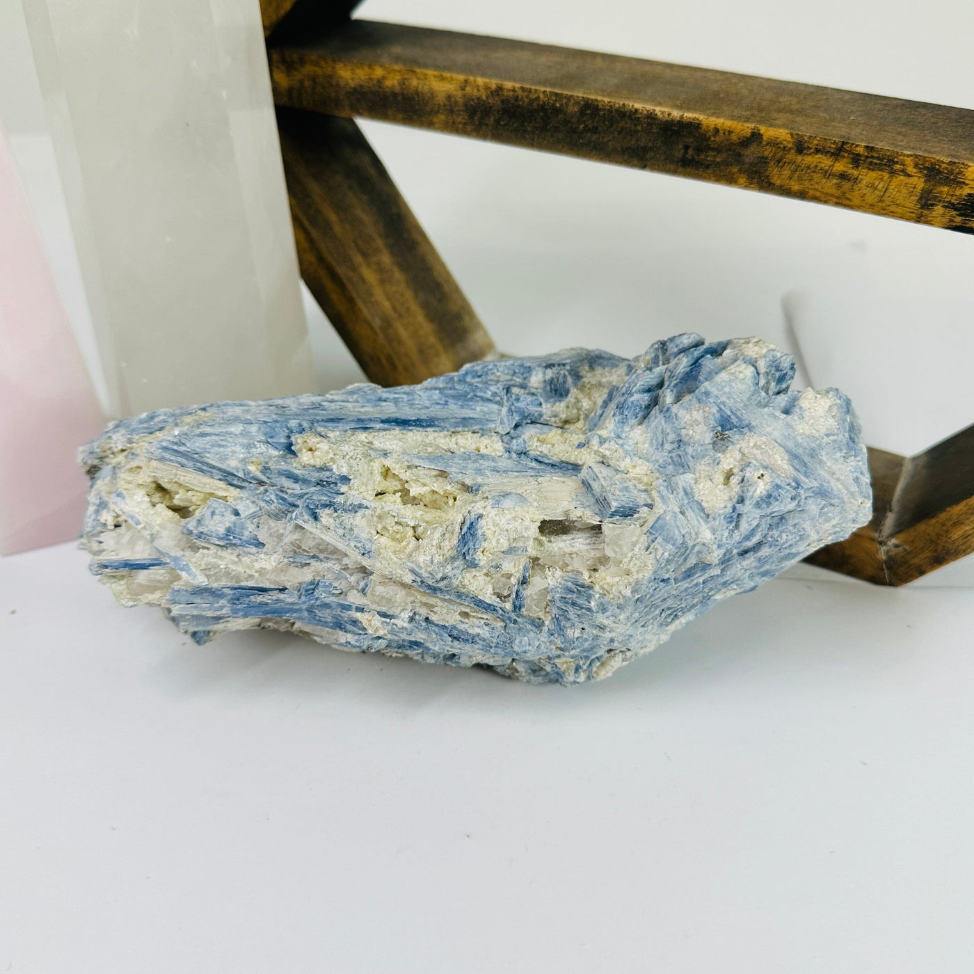 kyanite with decorations in the background