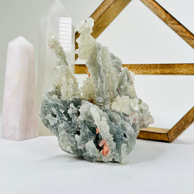 apophyllite with decorations in the background