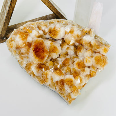 citrine cluster with decorations in the background