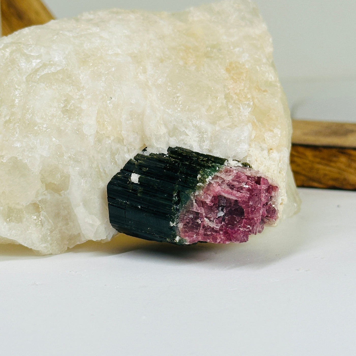 watermelon tourmaline with decorations in the background