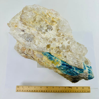 Aquamarine in matrix - giant aquamarine crystal embedded in large natural rough stone top view with ruler for size reference