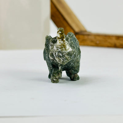 moss agate elephant with decorations in the background