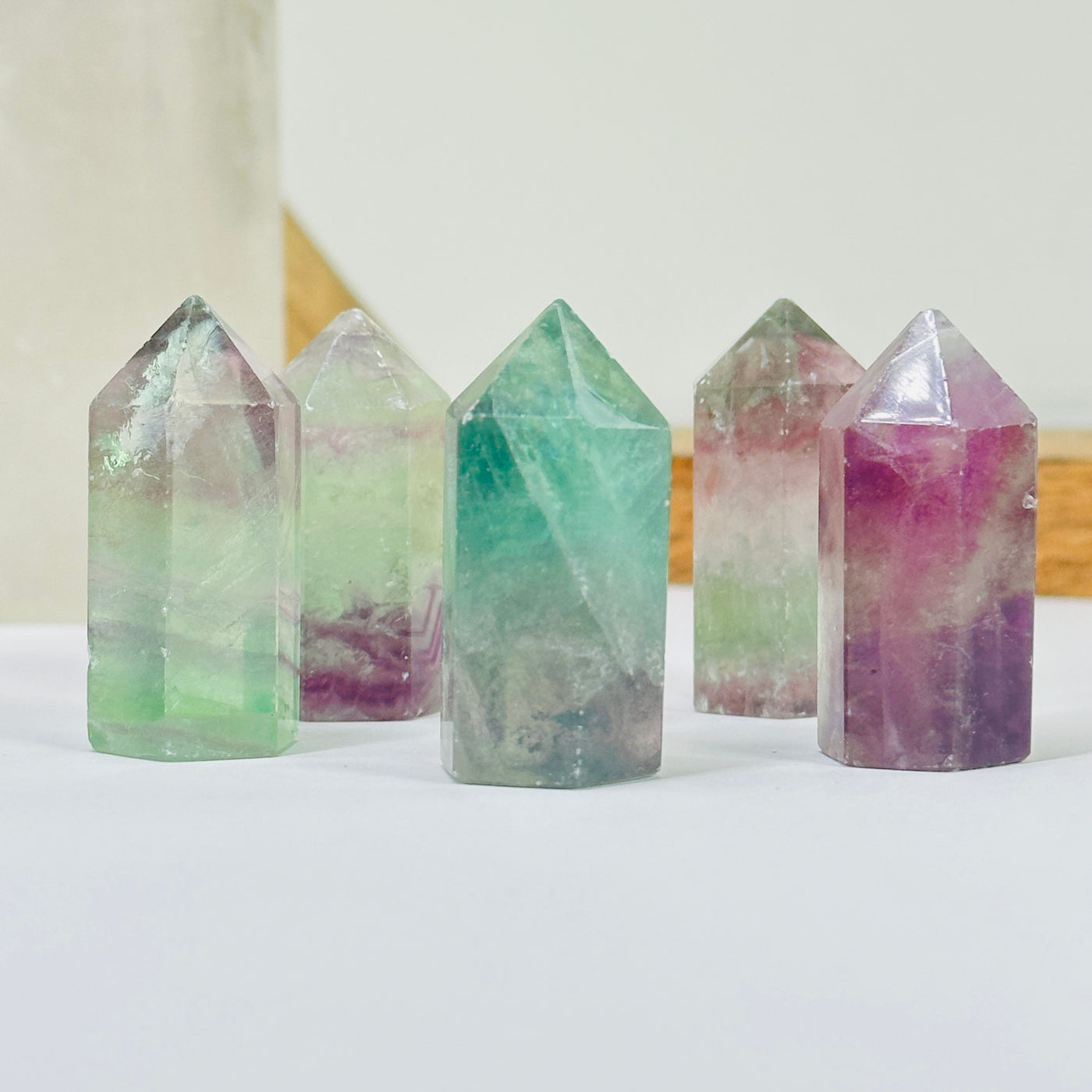 fluorite points with decorations in the background