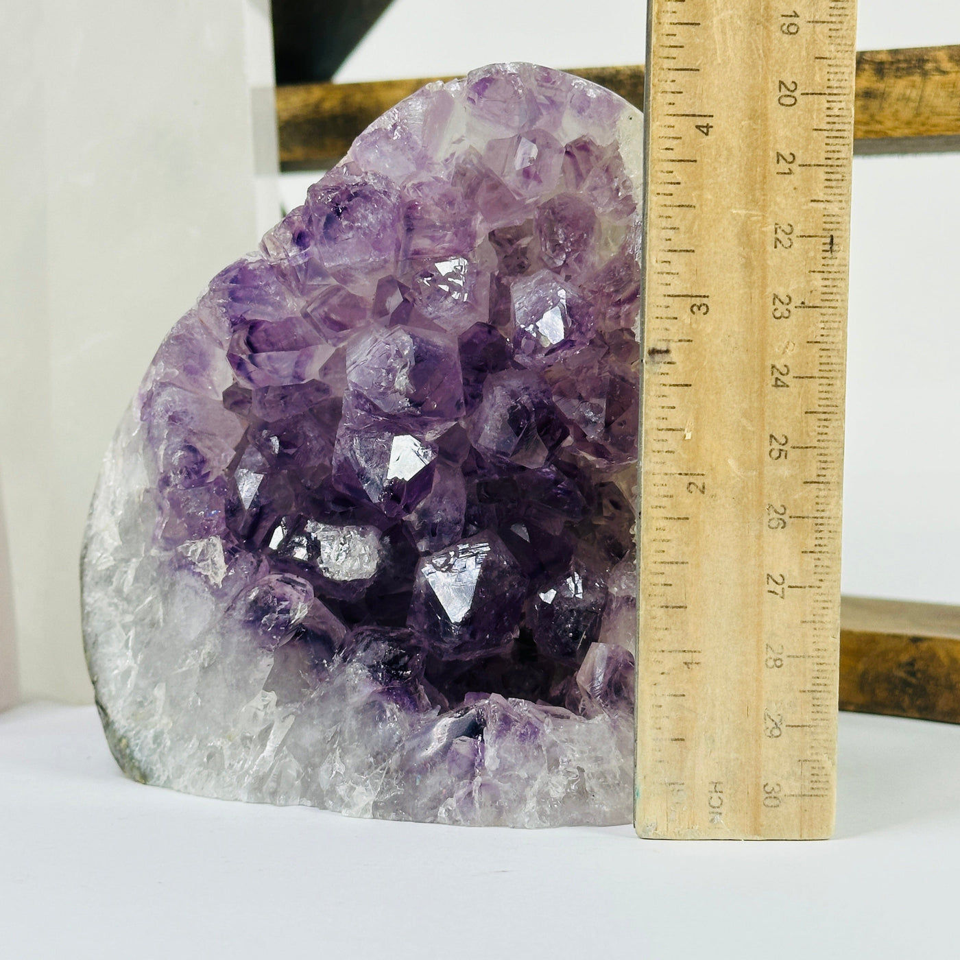 amethyst cut base next to a ruler for size reference