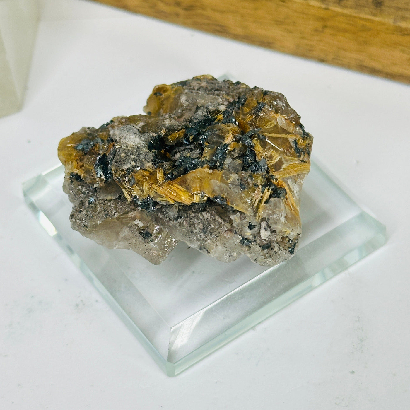 rutilated quartz with decorations in the background