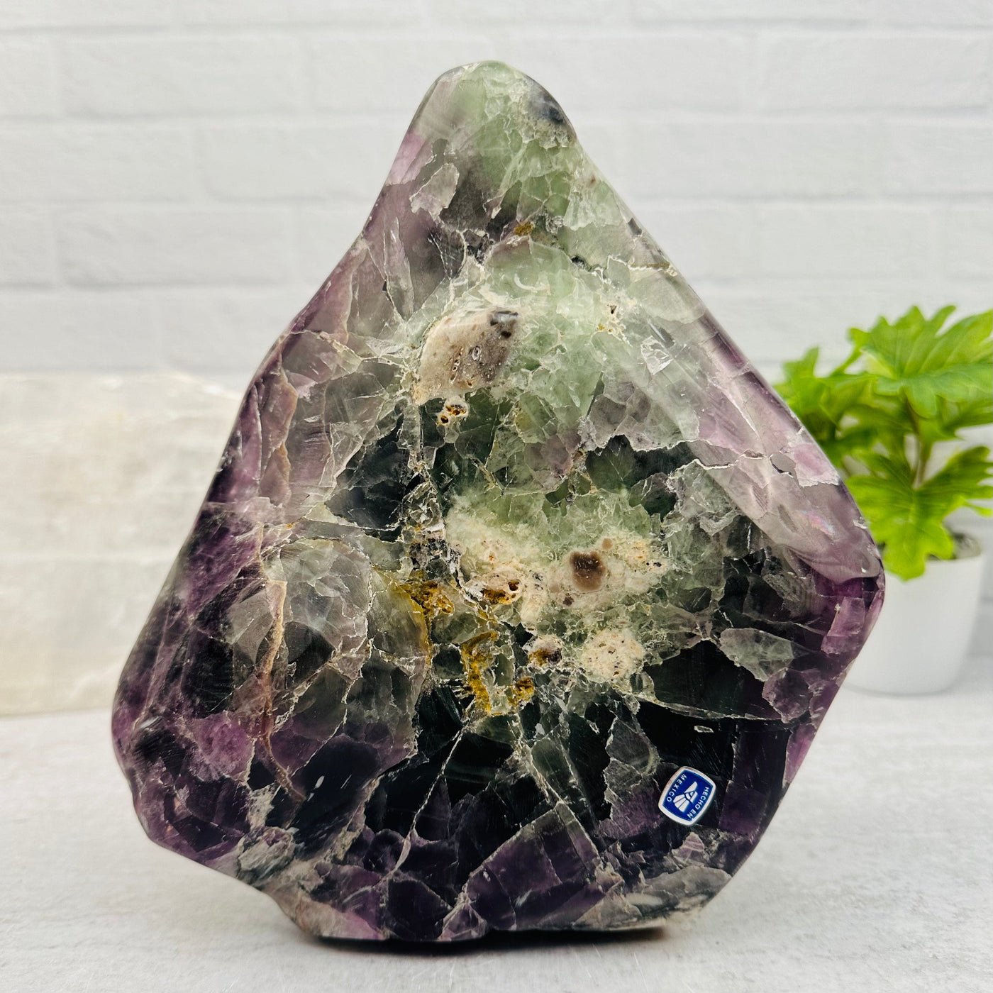 Large Tumbled Rainbow Fluorite Crystal displayed as home decor 