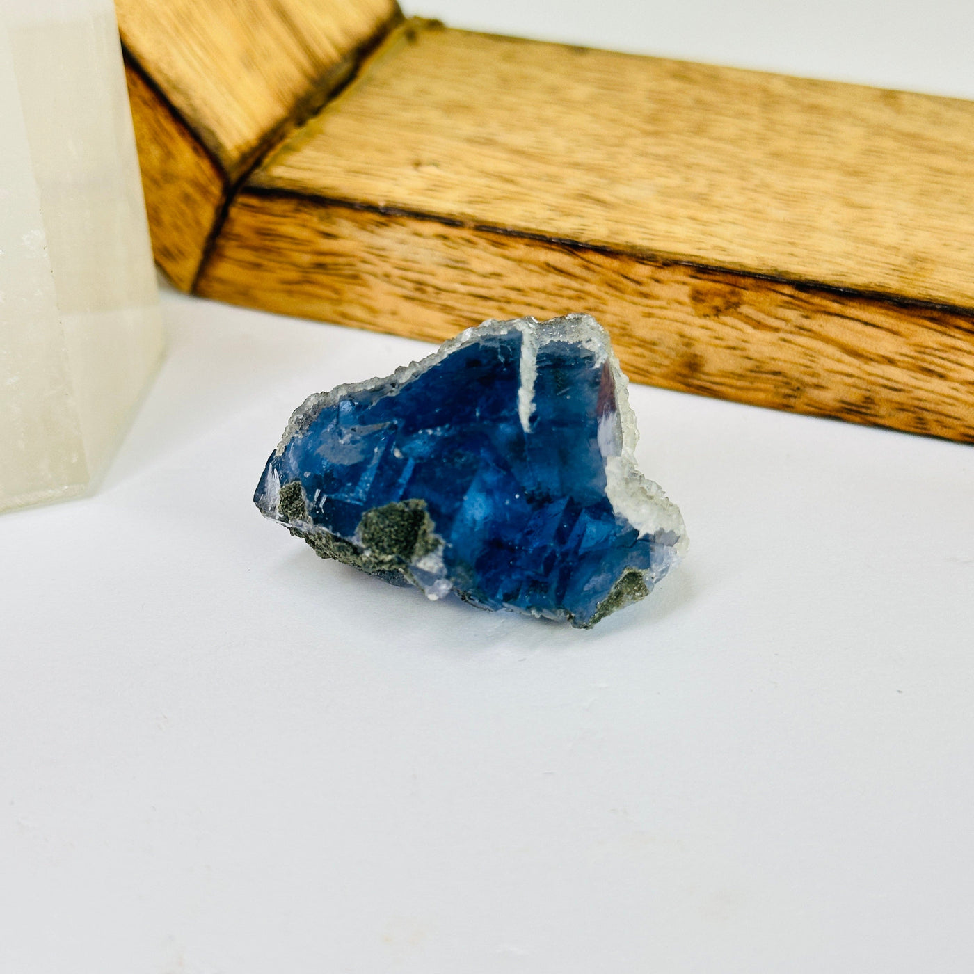 blue fluorite with decorations in the background